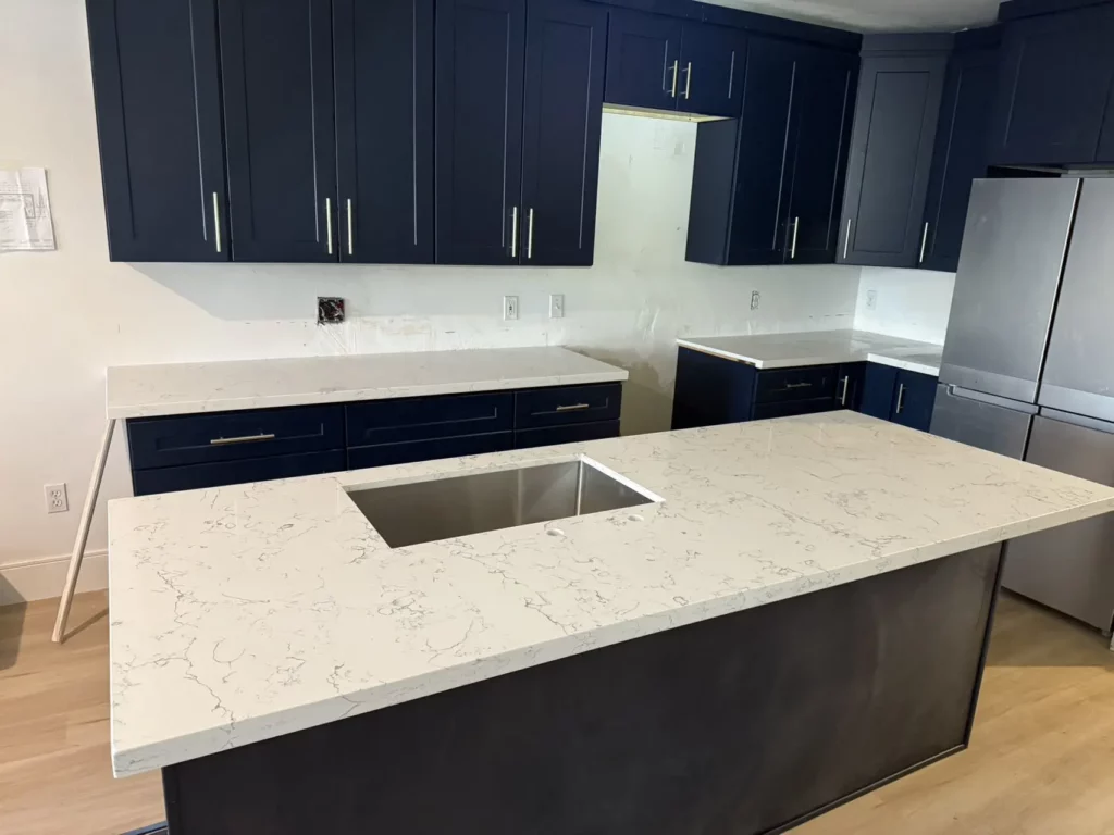 quartz countertops with blue cabinets